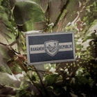 Spartanat Patch mit dem Text Bananenrepublik in den Farben Tarn RAL 7013 und Schwarz