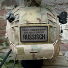 SPARTANAT Patch mit dem Text Ich höre Stimmen in meinem Kopf, aber sie sprechen russisch, mit Klett, in den Farben Schwarz und RAL7013